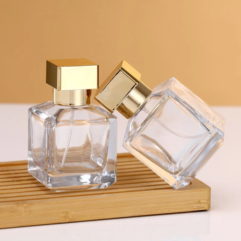Flacons de parfum en verre transparent avec bouchon doré 70/100ml