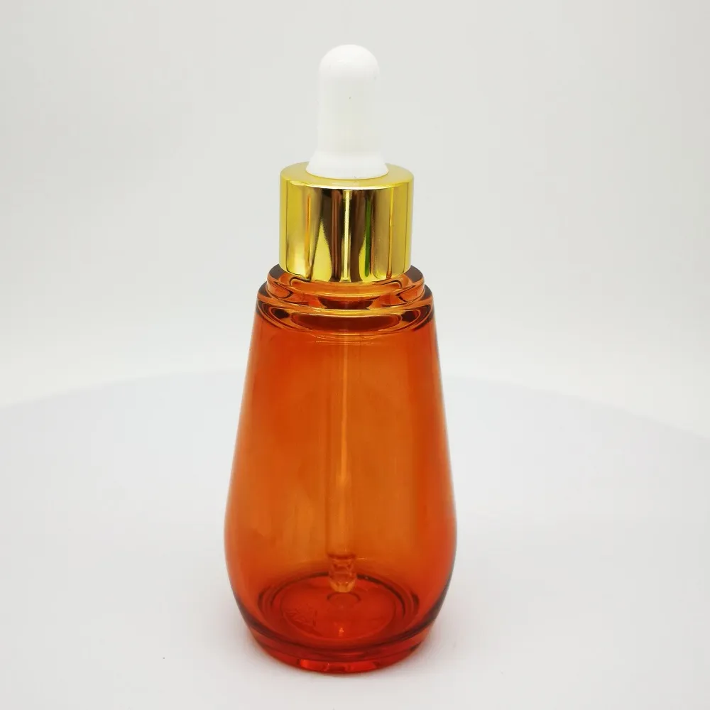 Frasco redondo de PET de pared gruesa de 50 ml, con cintura curva y perfil de gota, equipado con cuentagotas con acabado de aluminio anodizado para sérums y lociones